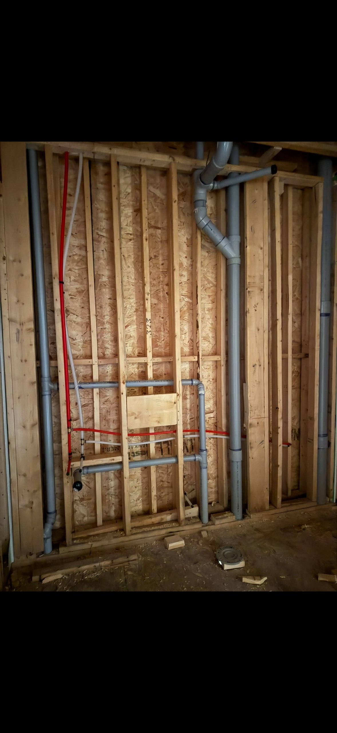 Residential plumbing rough-in with water and drain lines